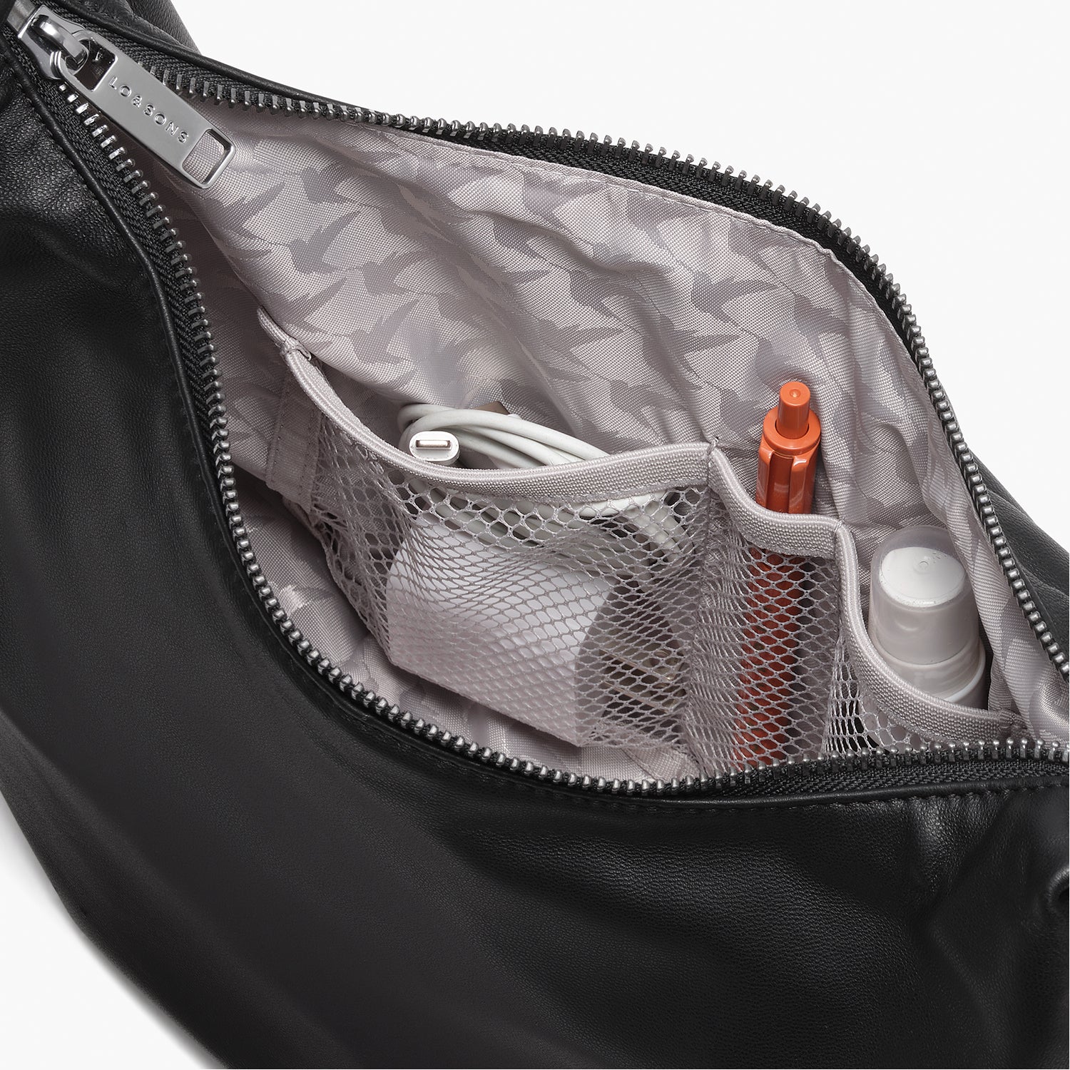 interior view of the mesh pockets in the Aoyama Leather in Black with Gunmetal hardware