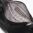 interior view of the card and zipper pockets of of the Aoyama Leather in Black with Gunmetal hardware