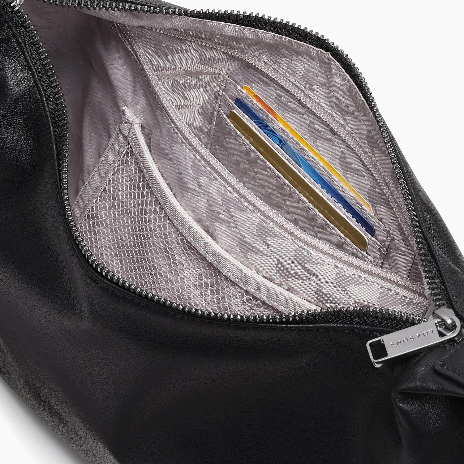 interior view of the card and zipper pockets of of the Aoyama Leather in Black with Gunmetal hardware