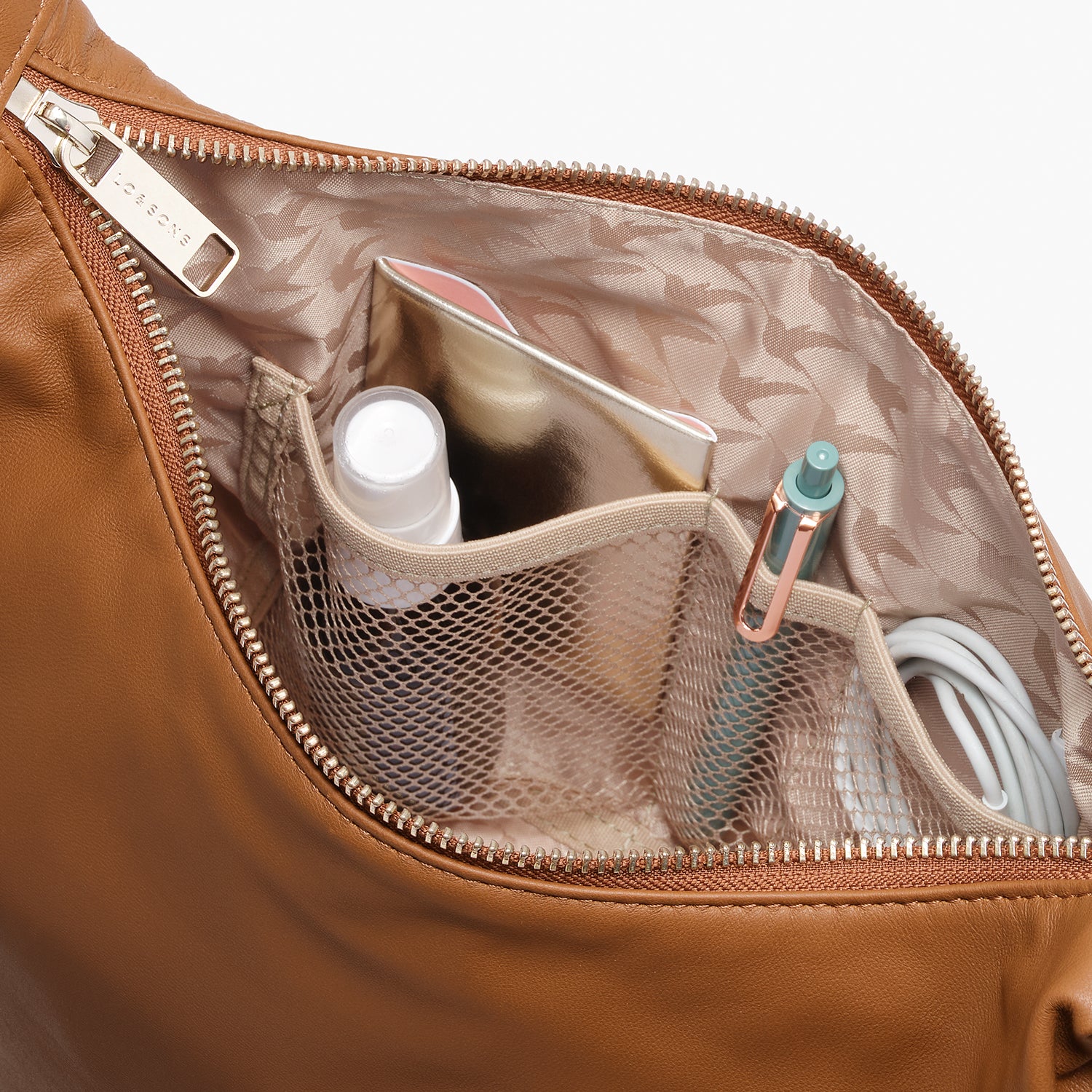 interior view of the mesh pockets of the Aoyama Leather in Cognac