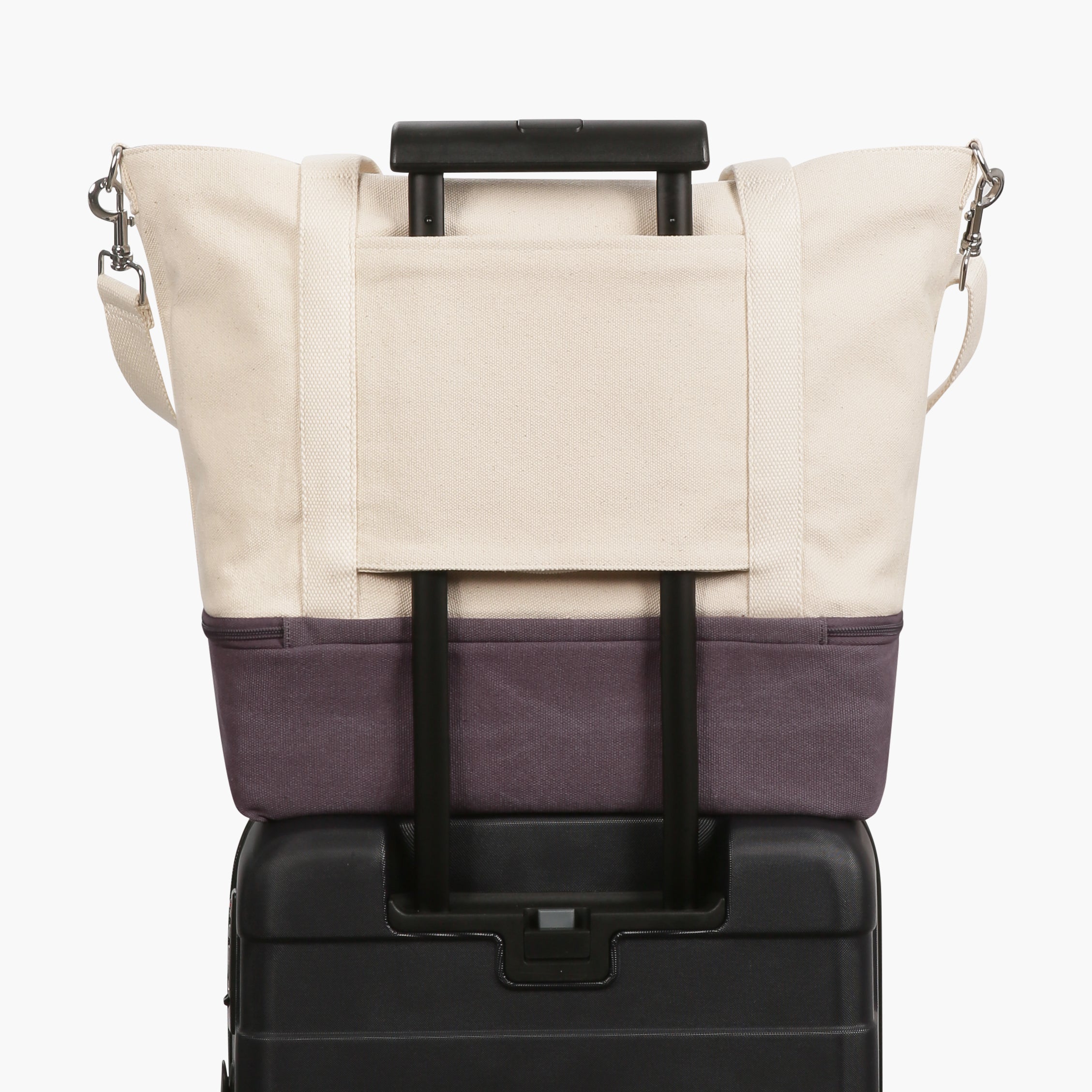 Suitcase handle sleeve of the Catalina Deluxe Tote in thistle colorblock