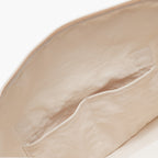 Interior pockets of the Lo & Sons Catalina Deluxe weekender bag in natural colored eco-friendly canvas material