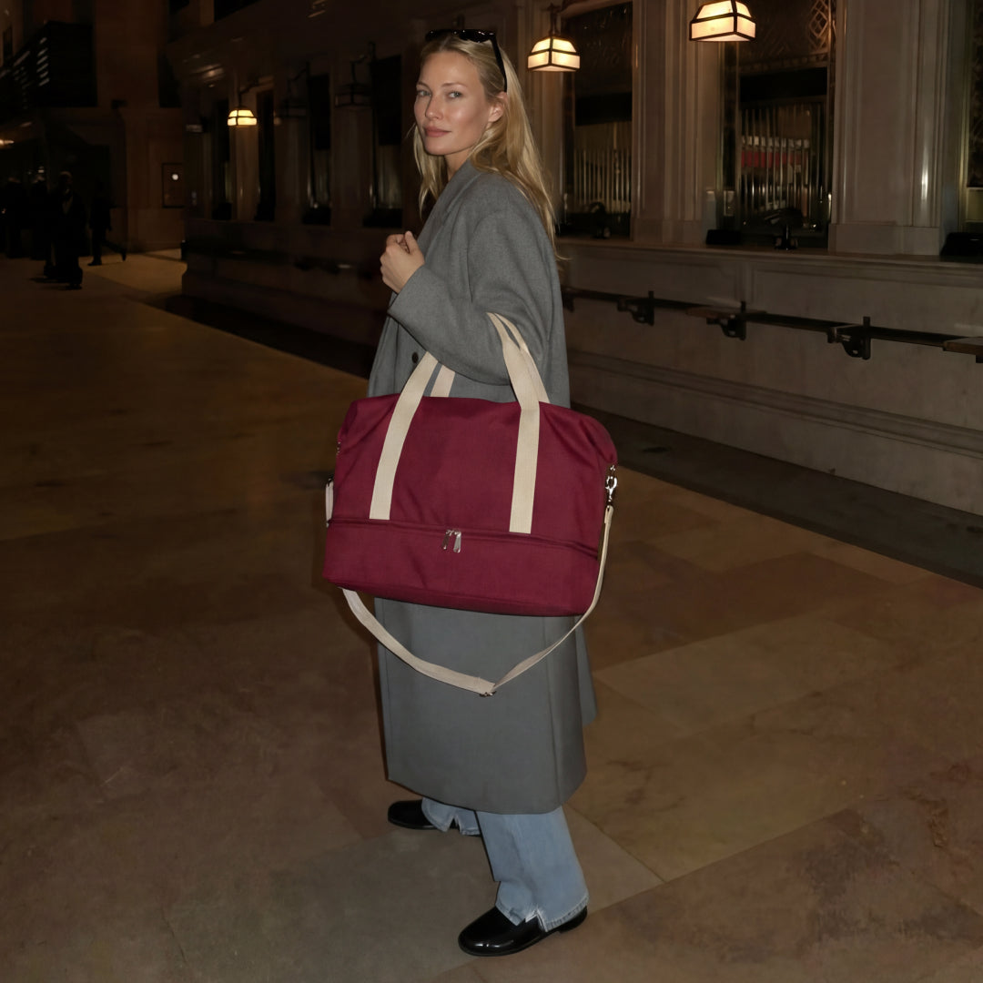 woman with Catalina Deluxe in Cabernet canvas traveling at the train station
