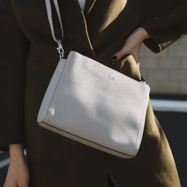 close-up of light grey Lo & Sons Pearl handbag and travel purse