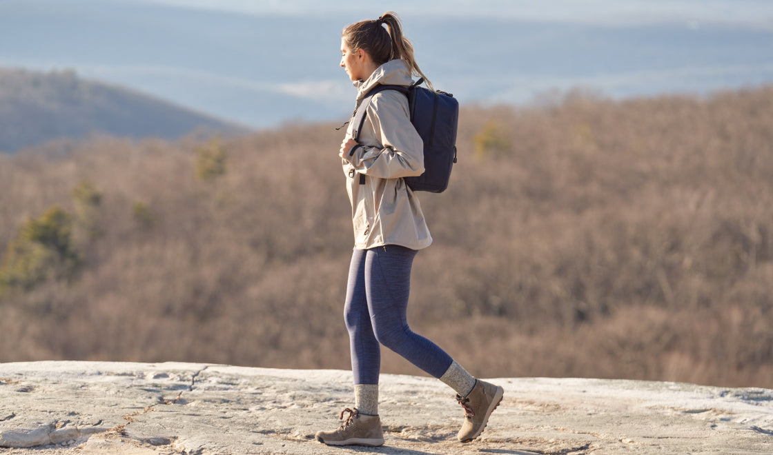 women wearing Lo & Sons Hanover 2 backpack hiking outdoors