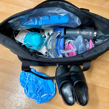 A Lo & Sons Catalina Deluxe bag packed with medical equipment at a hospital during the COVID-19 pandemic