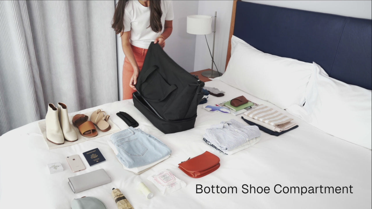 woman packing the Catalina Deluxe in poly in a bed room