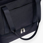 Close up of the front pocket on the Lo & Sons Catalina Day Tote in 600D Recycled Poly