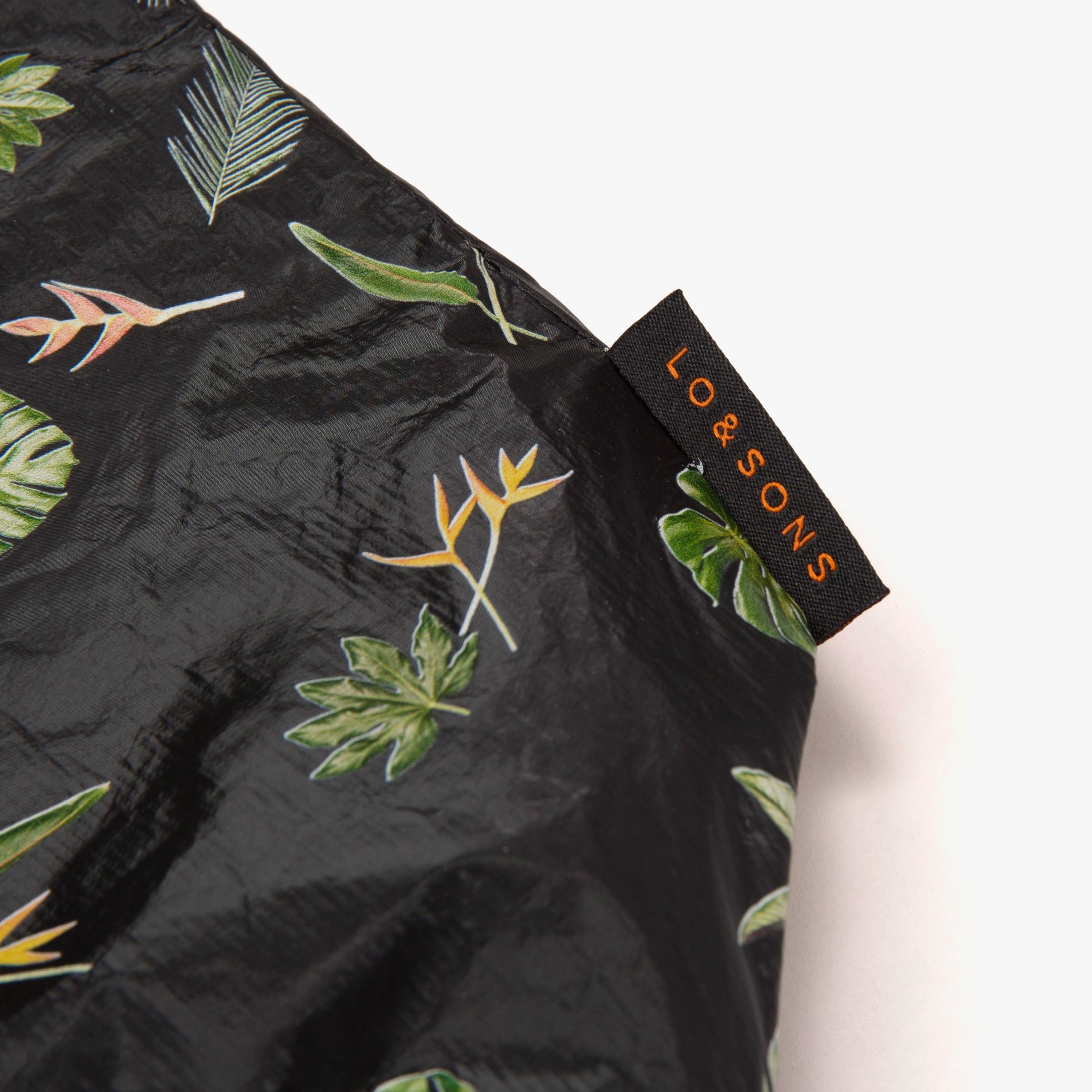 Lo and Sons Del Mar Packable Tote Large Leaf Print logo tag