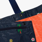 Interior pouch buttons close up - The Del Mar Packable Tote Large - Navy Hawaii Emoji - Lo & Sons