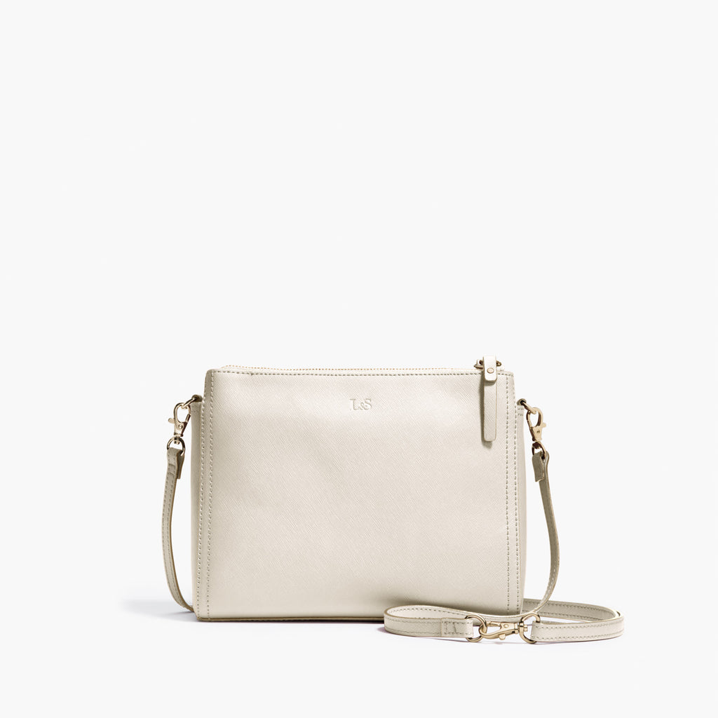 Ivory Quilted Leather Bag with Pearl Logo — Harriett's Closet